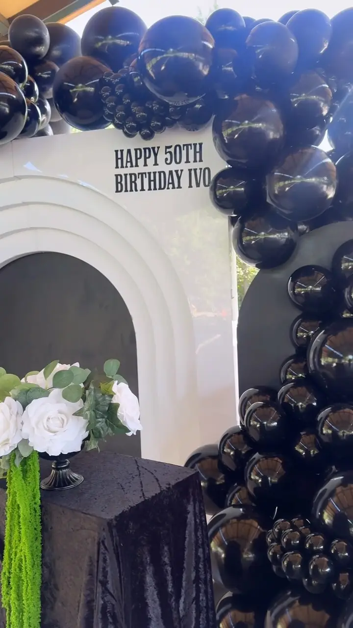 Black and gold balloon arch for a 50th birthday